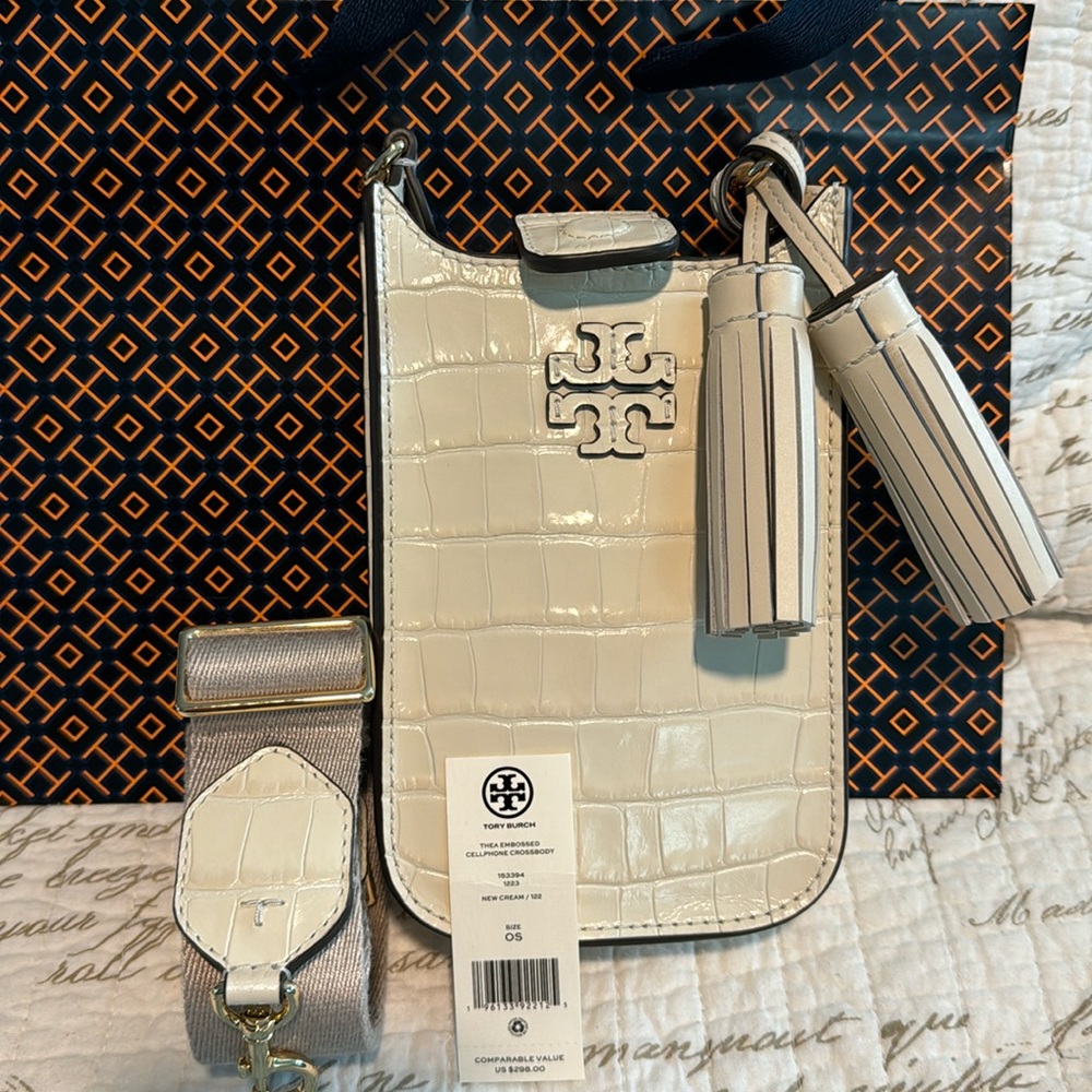 Brand new never worn Thea embossed cellphone crossbody in color New Cream.